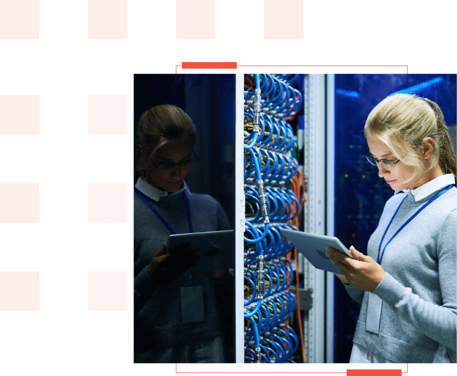 A woman is holding her tablet in front of a server.